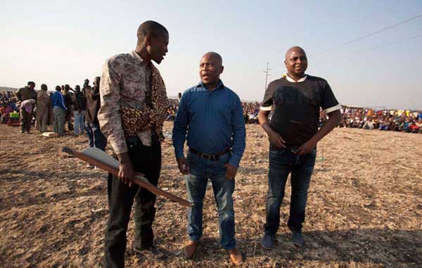 Cops distance themselves as Lonmin miners welcome Malema