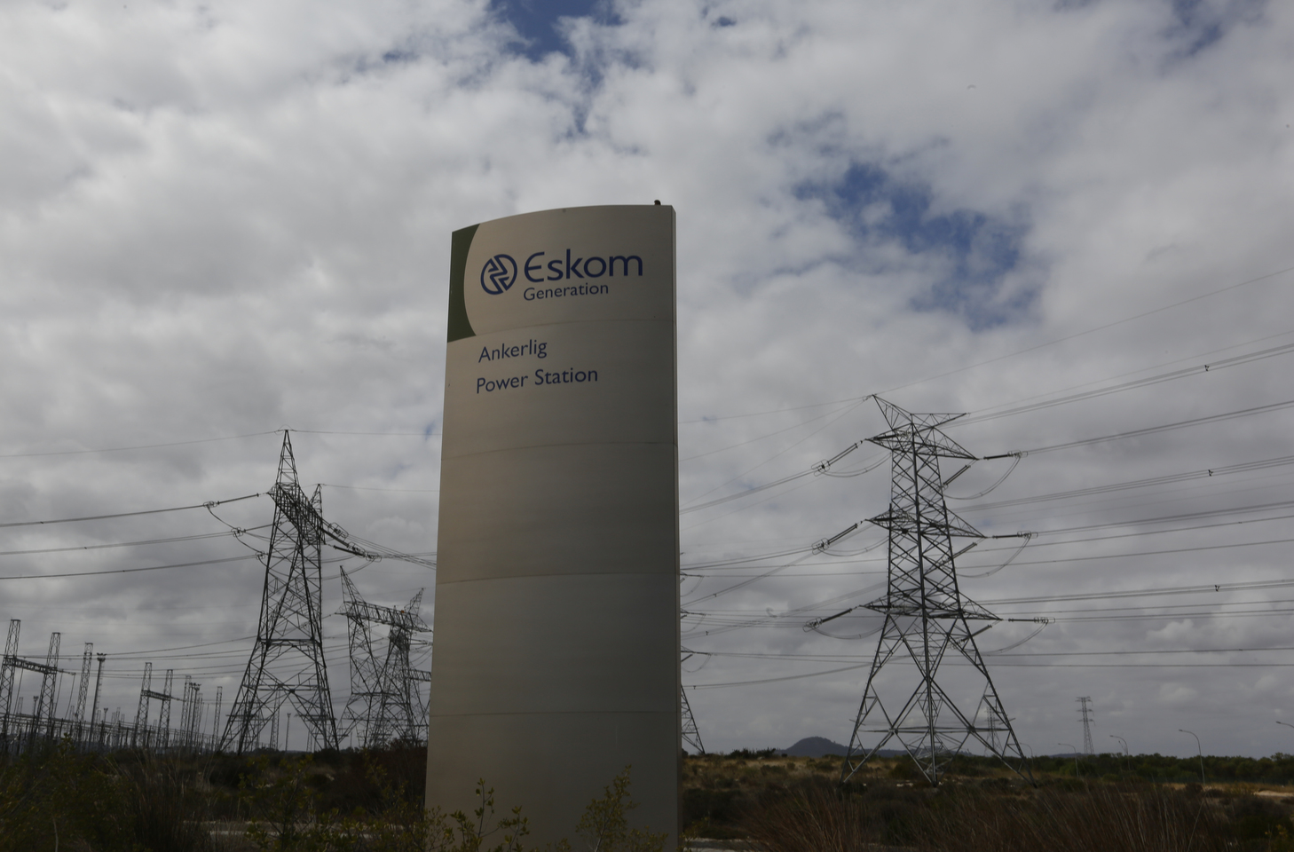 Pylons carry electricity from a sub-station of state power utility Eskom outside Cape Town in this picture taken March 20, 2016. REUTERS/Mike Hutchings - RTSBMS0